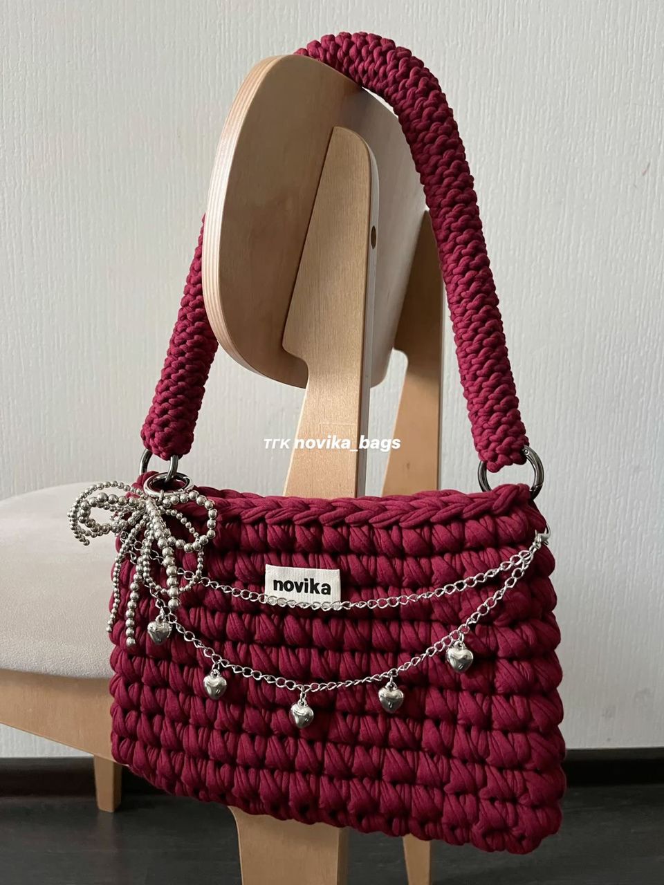 Burgundy crochet shoulder bag with silver chain and heart charms