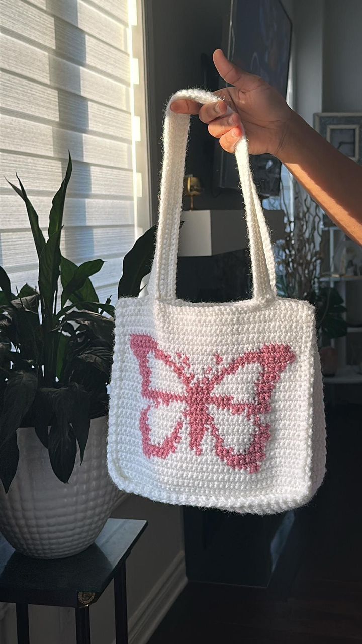 White crochet tote with pink tapestry butterfly design
